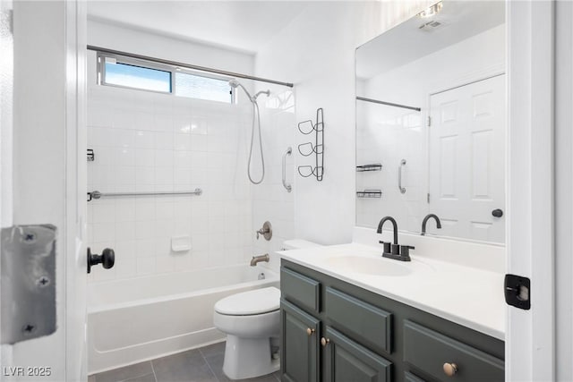 full bath with toilet, vanity, tile patterned flooring, and bathing tub / shower combination