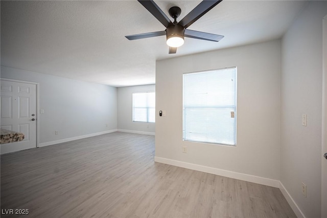 5055 W Hacienda Ave Unit 1097, Las Vegas, NV 89118 - unfurnished room featuring ceiling fan, light wood-type flooring, and baseboards