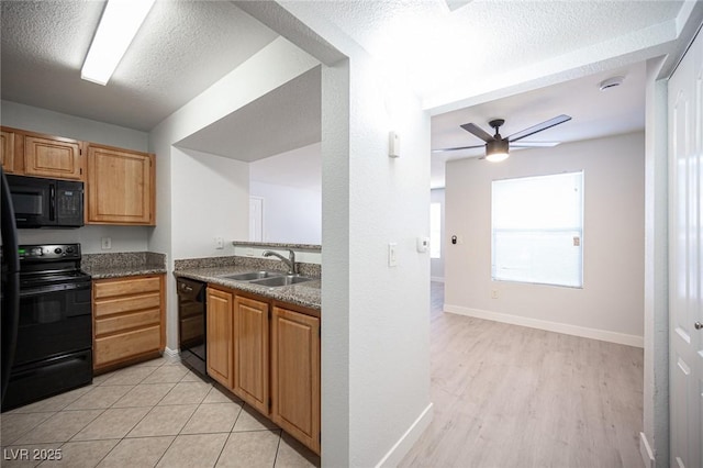 5055 W Hacienda Ave Unit 1097, Las Vegas, NV 89118 - kitchen with black appliances, a sink, ceiling fan, a textured ceiling, and light wood-type flooring