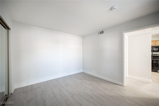 5055 W Hacienda Ave Unit 1097, Las Vegas, NV 89118 - unfurnished room featuring wood finished floors, baseboards, and a smoke detector