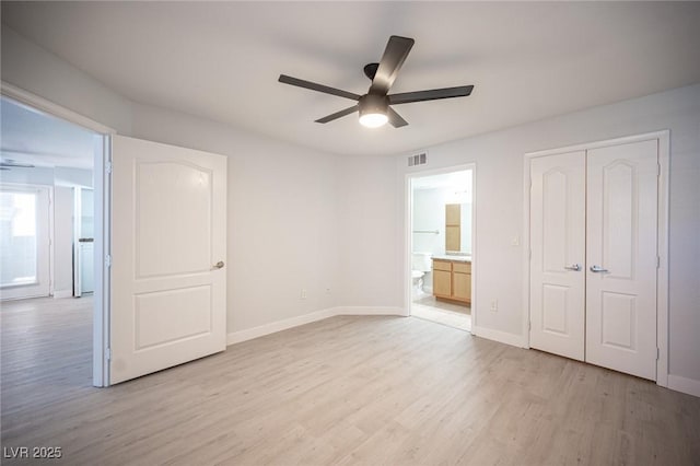 5055 W Hacienda Ave Unit 1097, Las Vegas, NV 89118 - unfurnished bedroom featuring light wood finished floors, baseboards, a closet, ensuite bath, and ceiling fan