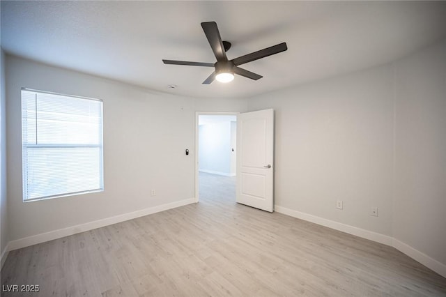 5055 W Hacienda Ave Unit 1097, Las Vegas, NV 89118 - spare room featuring a ceiling fan, wood finished floors, and baseboards