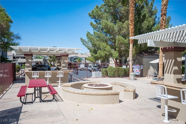 5055 W Hacienda Ave Unit 1097, Las Vegas, NV 89118 - view of patio / terrace with a pergola and an outdoor fire pit