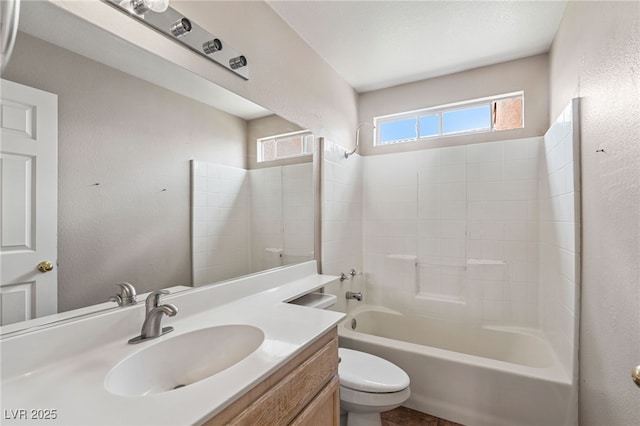 4517 Rodman Dr, Las Vegas, NV 89130 - bathroom featuring toilet, vanity,  shower combination, and a textured wall