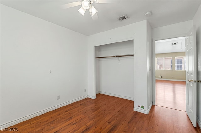 4517 Rodman Dr, Las Vegas, NV 89130 - unfurnished bedroom featuring wood finished floors, a closet, baseboards, and a ceiling fan