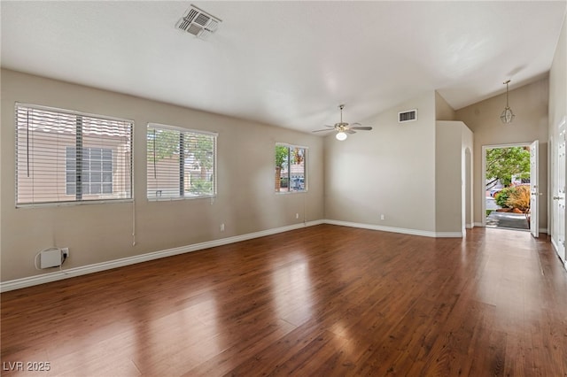 4517 Rodman Dr, Las Vegas, NV 89130 - unfurnished living room featuring healthy amount of natural light, wood finished floors, vaulted ceiling, a ceiling fan, and baseboards
