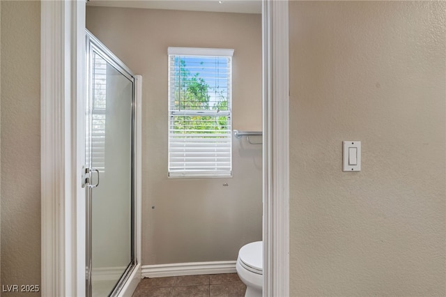4517 Rodman Dr, Las Vegas, NV 89130 - full bath with tile patterned floors, a shower stall, toilet, and baseboards
