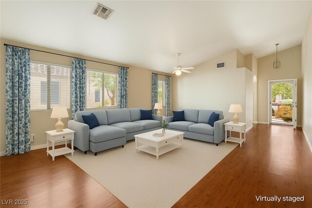 4517 Rodman Dr, Las Vegas, NV 89130 - living area with wood finished floors, vaulted ceiling, a ceiling fan, and baseboards