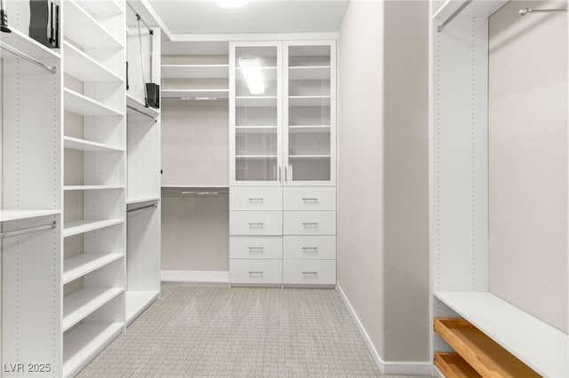 walk in closet featuring carpet