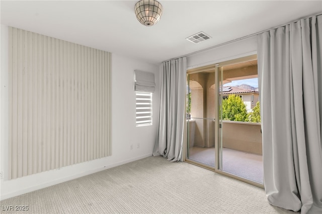 unfurnished bedroom featuring access to outside, carpet floors, and baseboards
