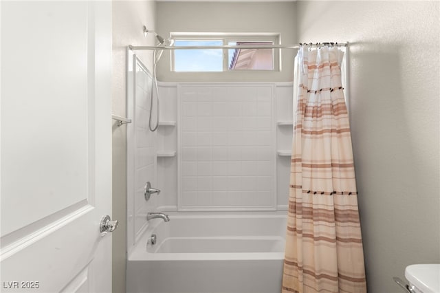bathroom with shower / bath combo with shower curtain and toilet