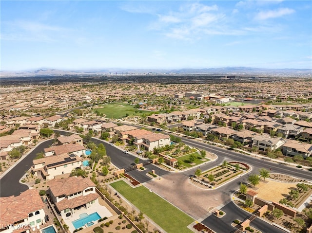 aerial overview of property's location featuring mountains and nearby suburban area