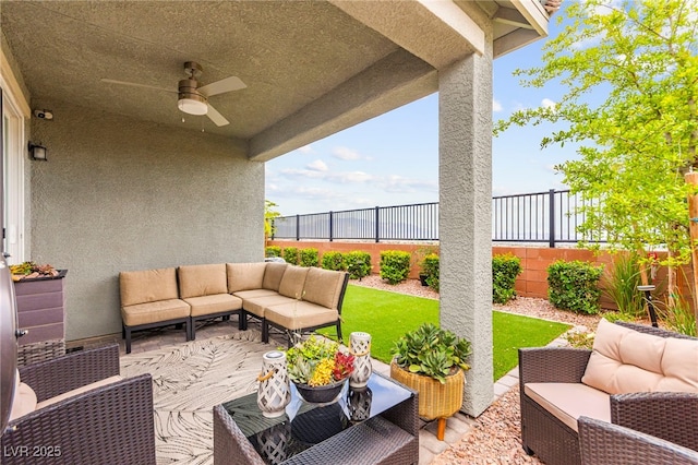 view of patio / terrace featuring an outdoor living space, a ceiling fan, and a fenced backyard