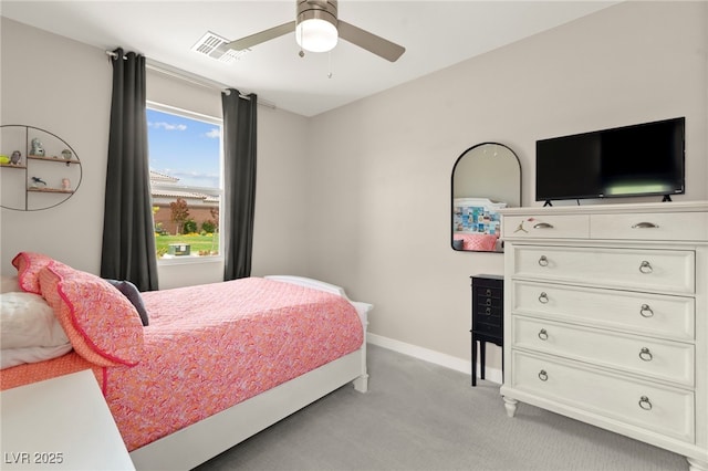 bedroom featuring light carpet, baseboards, and a ceiling fan