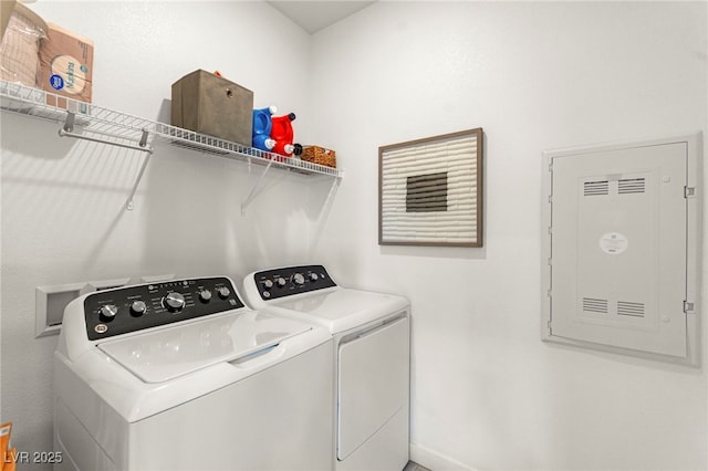 clothes washing area featuring washing machine and clothes dryer