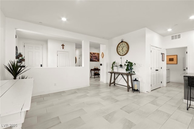 interior space with recessed lighting and baseboards