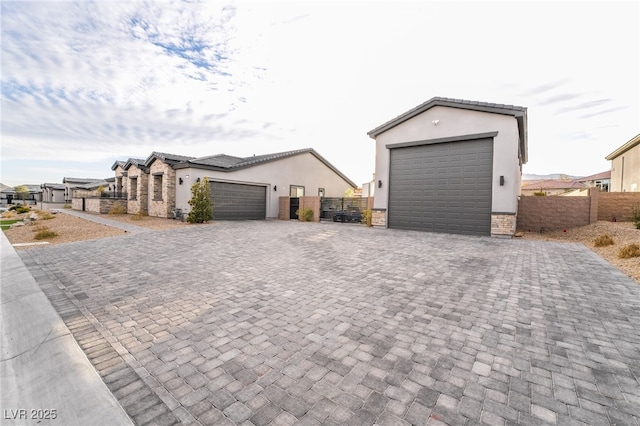5865 Alice Landing Ct, Las Vegas, NV 89149 - view of front of home featuring driveway, stucco siding, and fence