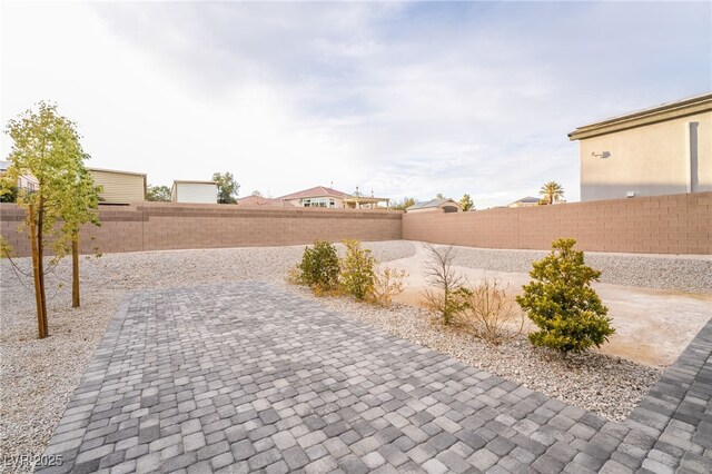 5865 Alice Landing Ct, Las Vegas, NV 89149 - fenced backyard with a patio