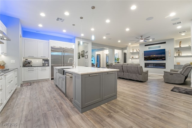 5865 Alice Landing Ct, Las Vegas, NV 89149 - kitchen with a ceiling fan, a sink, gray cabinets, white cabinets, and recessed lighting