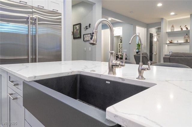 5865 Alice Landing Ct, Las Vegas, NV 89149 - kitchen with a sink, stainless steel built in refrigerator, light stone counters, and recessed lighting