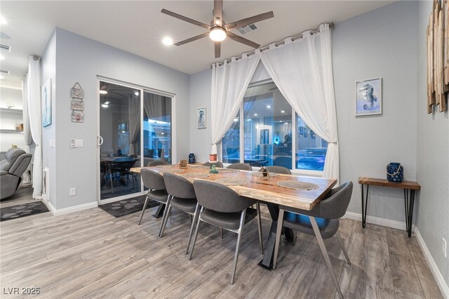 5865 Alice Landing Ct, Las Vegas, NV 89149 - dining room with light wood-type flooring, a ceiling fan, and baseboards