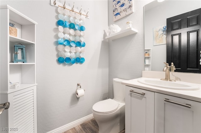 5865 Alice Landing Ct, Las Vegas, NV 89149 - bathroom featuring toilet, wood finished floors, vanity, and baseboards