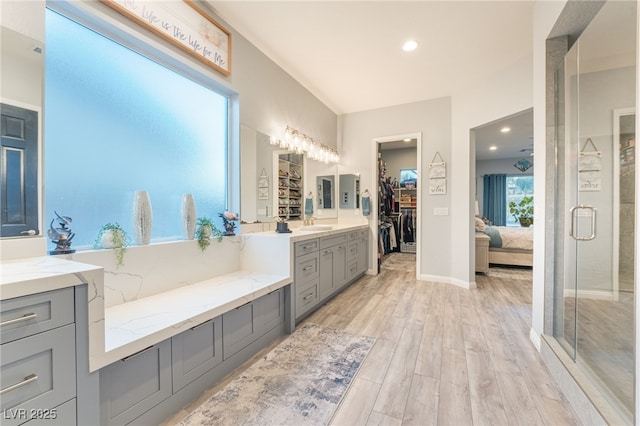 5865 Alice Landing Ct, Las Vegas, NV 89149 - full bathroom with vanity, wood finished floors, a stall shower, recessed lighting, and a spacious closet