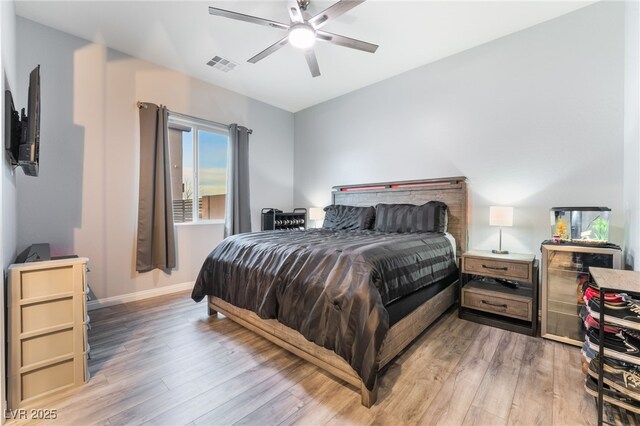 5865 Alice Landing Ct, Las Vegas, NV 89149 - bedroom featuring light wood-type flooring, baseboards, and a ceiling fan