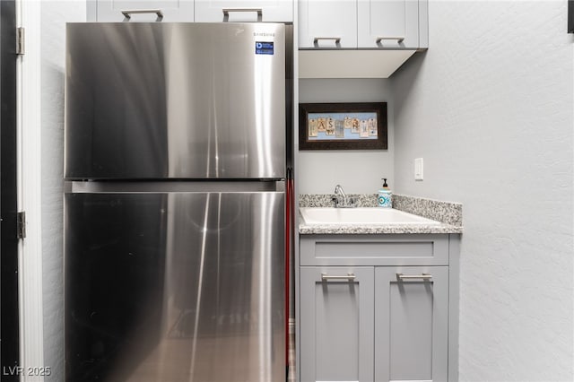 5865 Alice Landing Ct, Las Vegas, NV 89149 - bathroom featuring vanity and a textured wall