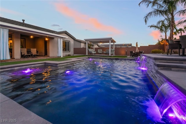 5865 Alice Landing Ct, Las Vegas, NV 89149 - pool at dusk with a fenced backyard and a patio