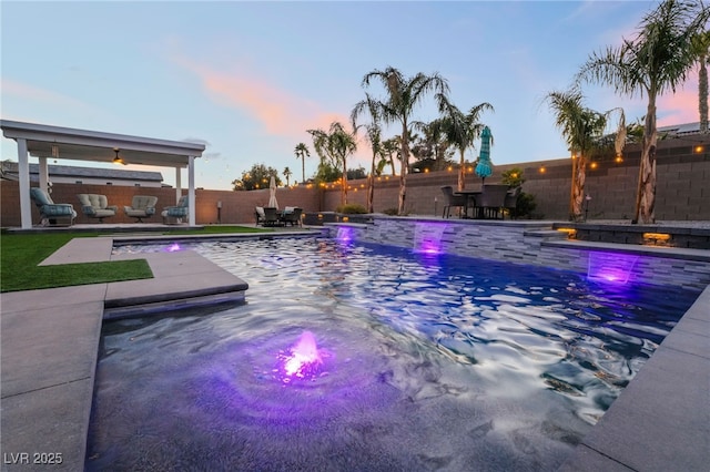 5865 Alice Landing Ct, Las Vegas, NV 89149 - pool at dusk featuring a fenced backyard and a patio