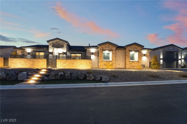 5865 Alice Landing Ct, Las Vegas, NV 89149 - view of front of home with a garage, fence, and stone siding