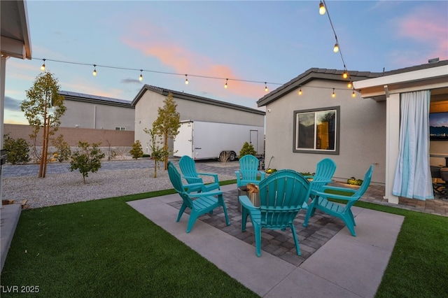 5865 Alice Landing Ct, Las Vegas, NV 89149 - patio terrace at dusk with an outdoor fire pit