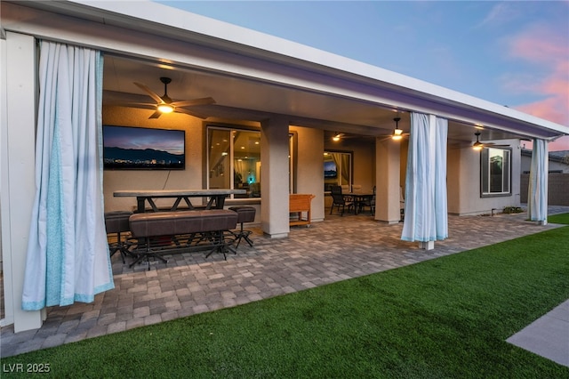 5865 Alice Landing Ct, Las Vegas, NV 89149 - rear view of property featuring a ceiling fan, a patio, outdoor dining area, and a yard