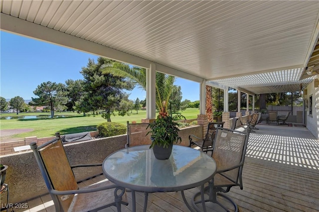 893 Fairway Dr, Boulder City, NV 89005 - wooden terrace featuring outdoor dining space, a water view, a yard, a patio area, and view of golf course