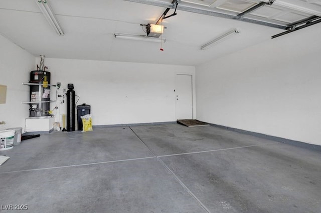 garage featuring water heater and a garage door opener