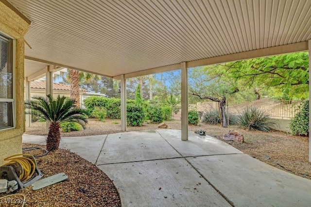 view of patio / terrace featuring fence