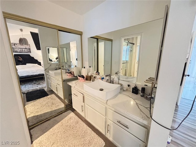 bathroom featuring connected bathroom and vanity