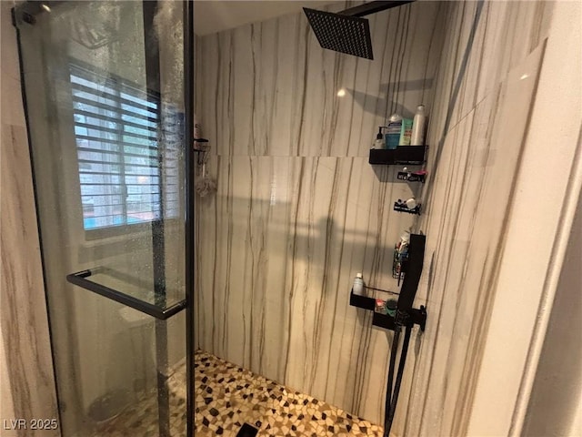 full bathroom with a marble finish shower