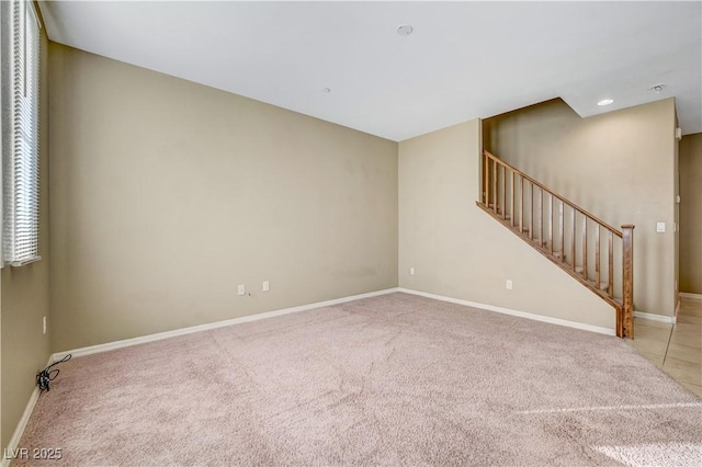 11420 Ogden Mills Dr Unit 101, Las Vegas, NV 89135 - carpeted empty room with baseboards and stairway