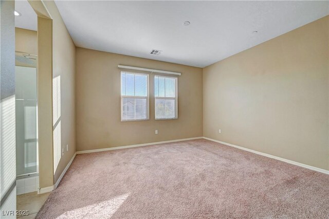 11420 Ogden Mills Dr Unit 101, Las Vegas, NV 89135 - empty room with light colored carpet and baseboards