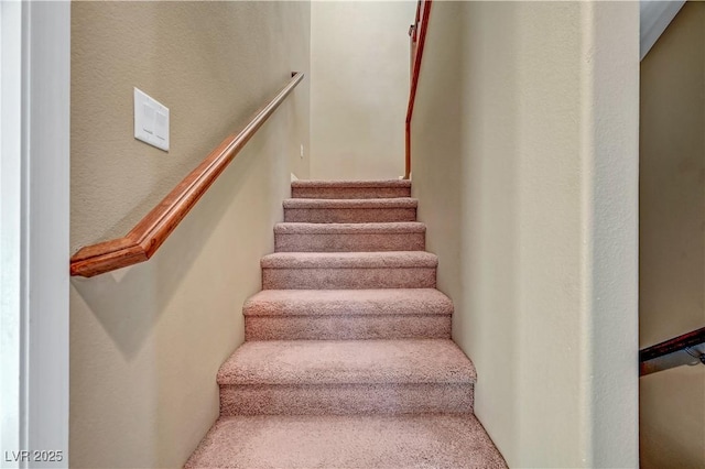 11420 Ogden Mills Dr Unit 101, Las Vegas, NV 89135 - staircase with carpet flooring