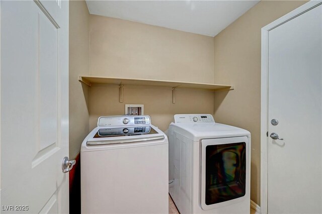 11420 Ogden Mills Dr Unit 101, Las Vegas, NV 89135 - clothes washing area with washer and clothes dryer