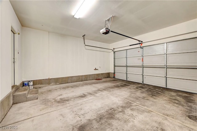 11420 Ogden Mills Dr Unit 101, Las Vegas, NV 89135 - garage featuring a garage door opener
