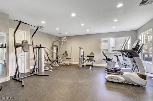 exercise room featuring recessed lighting and baseboards