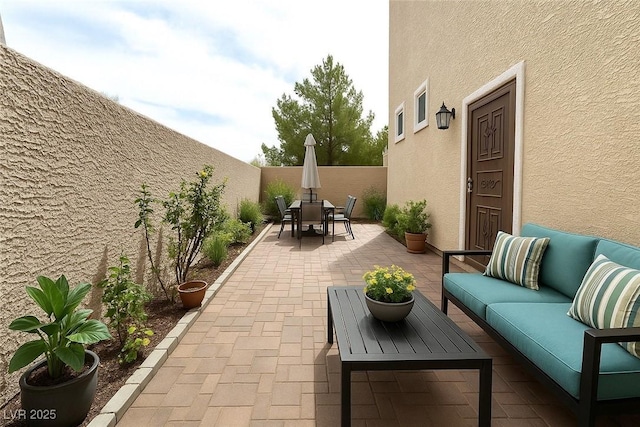 10372 Beautiful Fruit St, Las Vegas, NV 89183 - fenced backyard with a patio, an outdoor living space, and outdoor dining area