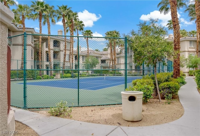 view of tennis court with fence