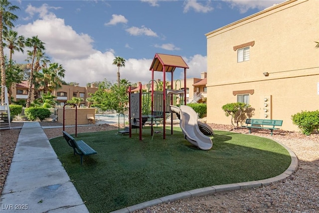 communal playground with a residential view