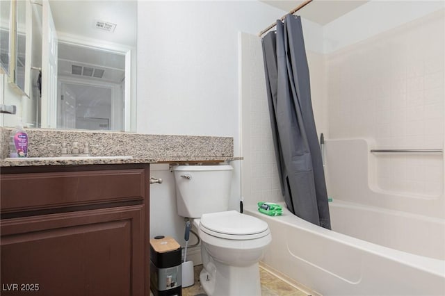 bathroom featuring toilet, vanity, and shower / bath combo