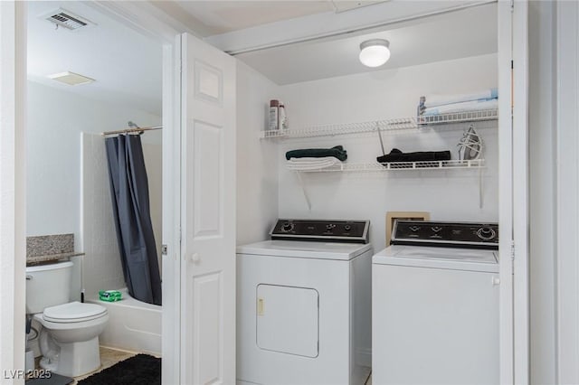 laundry room with independent washer and dryer